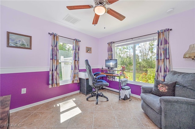 office space featuring light tile patterned flooring and ceiling fan