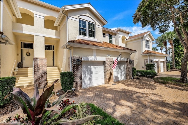 townhome / multi-family property featuring a garage