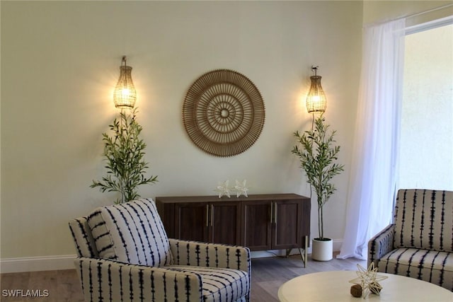 sitting room featuring hardwood / wood-style floors and a wealth of natural light