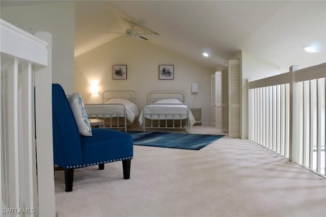 bedroom featuring lofted ceiling, light carpet, and ceiling fan