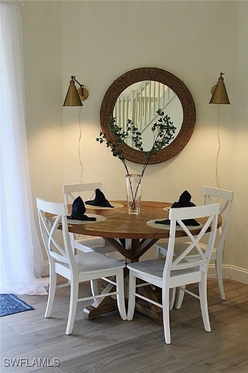 dining room with hardwood / wood-style flooring