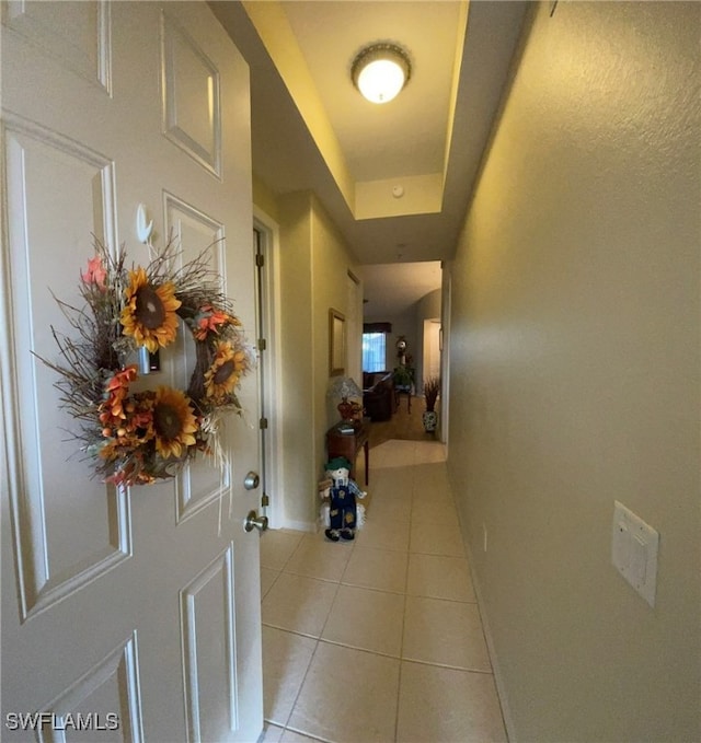 corridor with light tile patterned floors