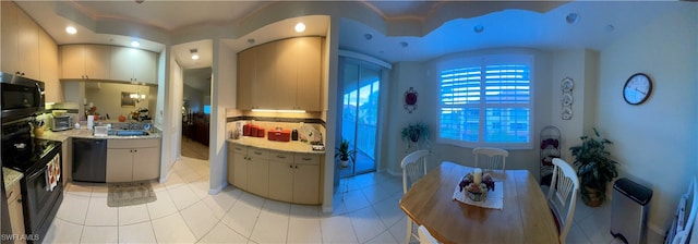 kitchen with light tile patterned flooring and black appliances