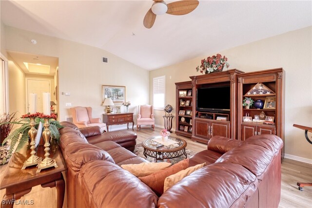 1105 Van Loon Commons Cir Unit 301, Cape Coral, FL 33909 - living area featuring vaulted ceiling, wood finished floors, a ceiling fan, and baseboards