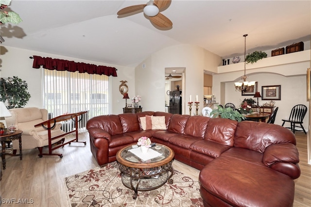 1105 Van Loon Commons Cir Unit 301, Cape Coral, FL 33909 - living room with vaulted ceiling, wood finished floors, a chandelier, and a ceiling fan