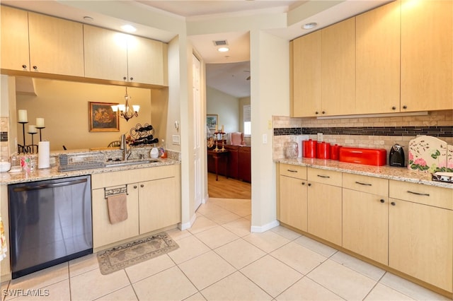 1105 Van Loon Commons Cir Unit 301, Cape Coral, FL 33909 - kitchen featuring stainless steel dishwasher, a sink, tasteful backsplash, light stone counters, and a chandelier
