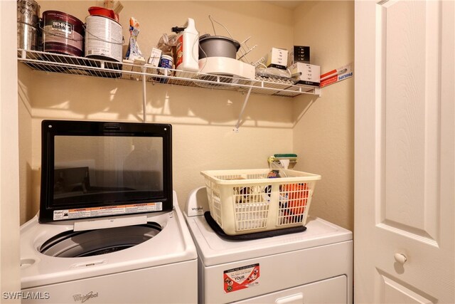1105 Van Loon Commons Cir Unit 301, Cape Coral, FL 33909 - laundry area with washing machine and clothes dryer
