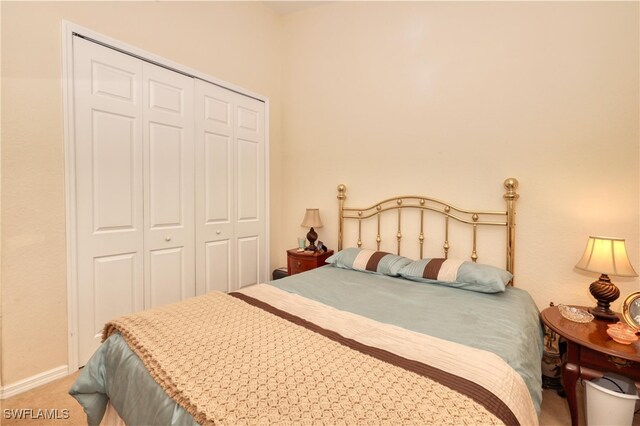1105 Van Loon Commons Cir Unit 301, Cape Coral, FL 33909 - bedroom featuring a closet, carpet floors, and baseboards