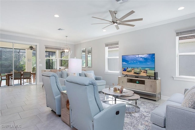 living room with visible vents, crown molding, baseboards, recessed lighting, and ceiling fan with notable chandelier