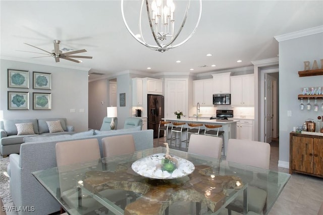 dining area featuring light tile patterned flooring, recessed lighting, ceiling fan with notable chandelier, and ornamental molding