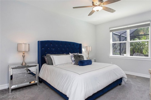 bedroom featuring baseboards, carpet floors, and a ceiling fan