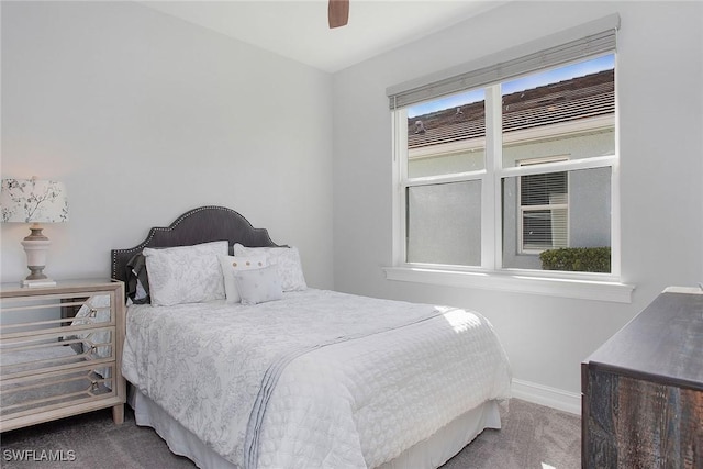 bedroom with ceiling fan, baseboards, and carpet