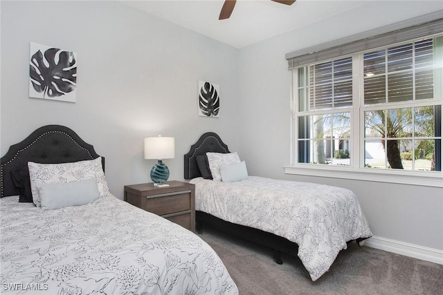 bedroom featuring carpet flooring, a ceiling fan, and baseboards