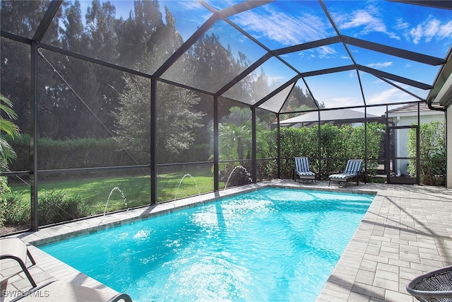 outdoor pool featuring a lanai and a patio area