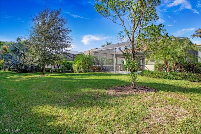 view of yard with a lanai