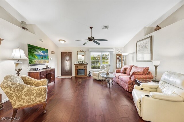 living room with dark wood-type flooring, ceiling fan, and lofted ceiling