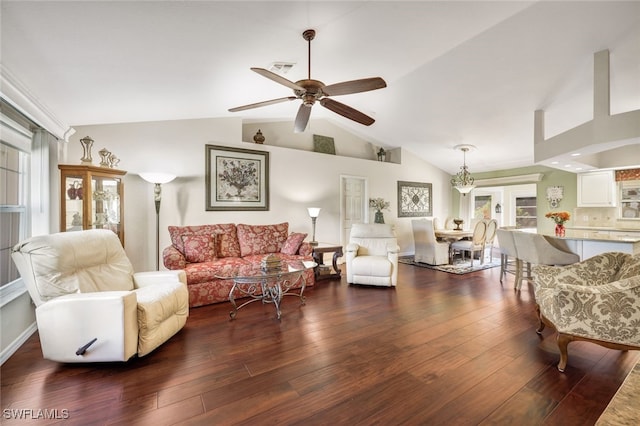 living room with ceiling fan, dark wood-type flooring, and vaulted ceiling