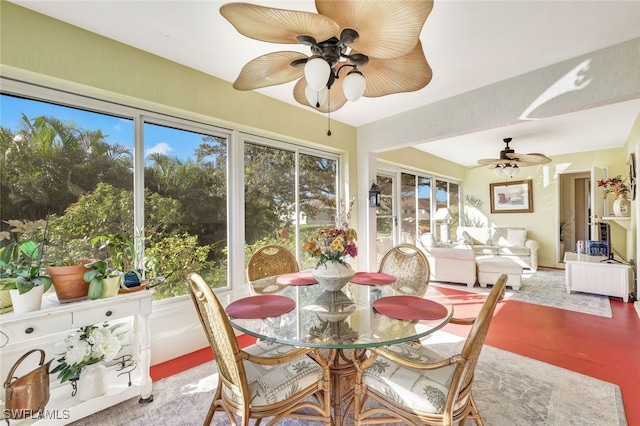 sunroom featuring ceiling fan