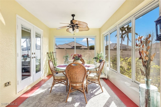 sunroom featuring ceiling fan and a healthy amount of sunlight