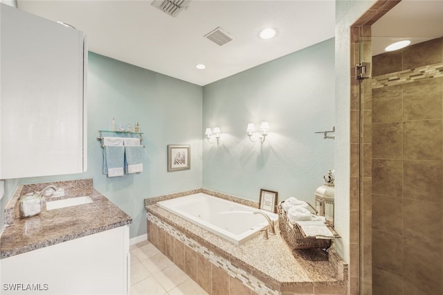 bathroom with tile patterned floors, separate shower and tub, and vanity