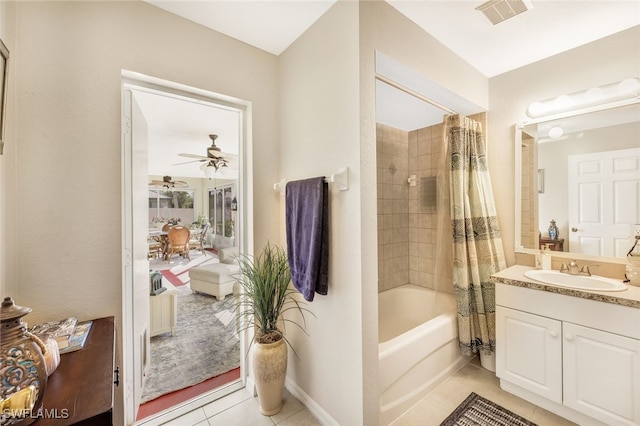 bathroom with shower / bath combination with curtain, vanity, tile patterned floors, and ceiling fan