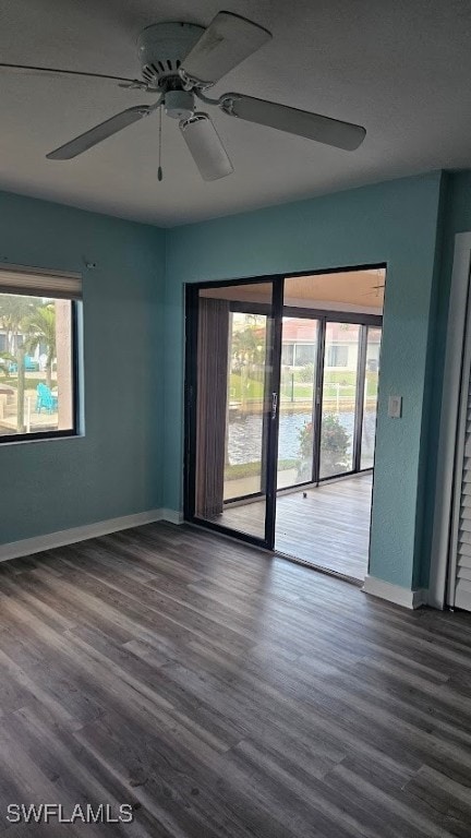 spare room featuring ceiling fan and wood-type flooring