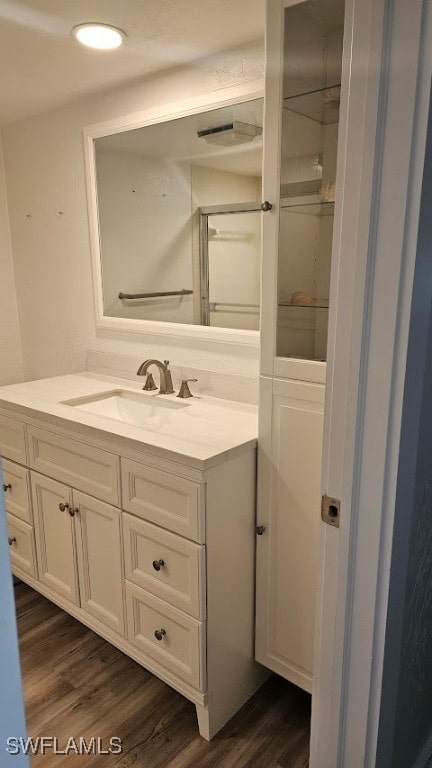 bathroom with vanity and hardwood / wood-style floors