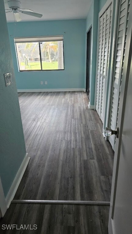 interior space featuring a healthy amount of sunlight, dark hardwood / wood-style floors, and ceiling fan