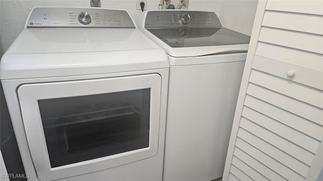 laundry room with separate washer and dryer