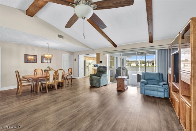 living room with dark hardwood / wood-style flooring, vaulted ceiling with beams, and ceiling fan with notable chandelier