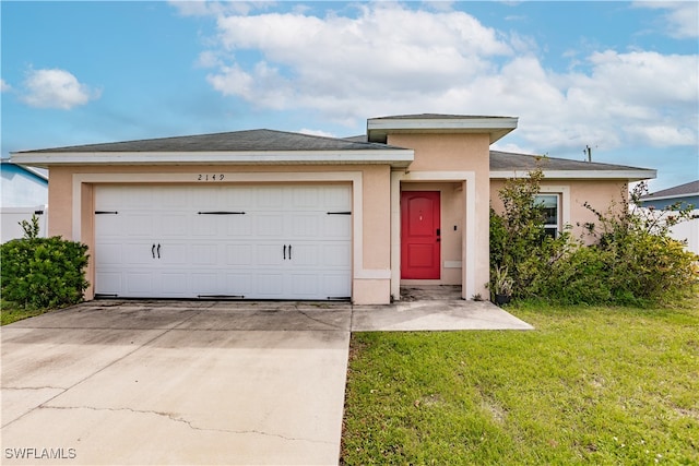 prairie-style house with a garage and a front lawn