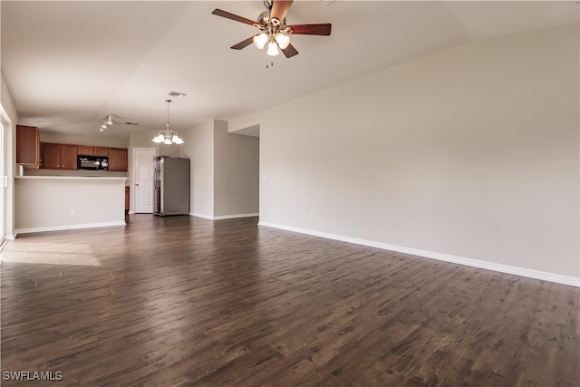 unfurnished living room featuring dark wood-type flooring, lofted ceiling, and ceiling fan with notable chandelier