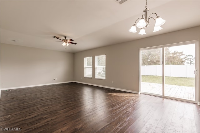 unfurnished room with dark wood-type flooring and ceiling fan with notable chandelier