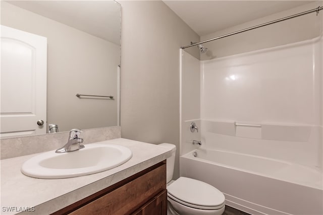 full bathroom with  shower combination, vanity, and toilet