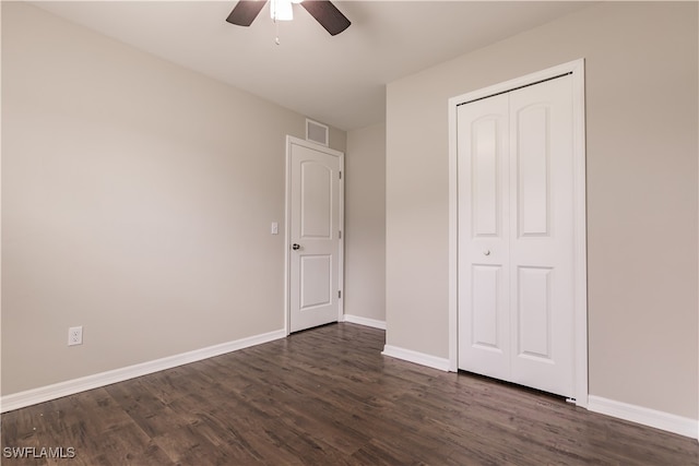 unfurnished bedroom featuring a closet, ceiling fan, and dark hardwood / wood-style floors