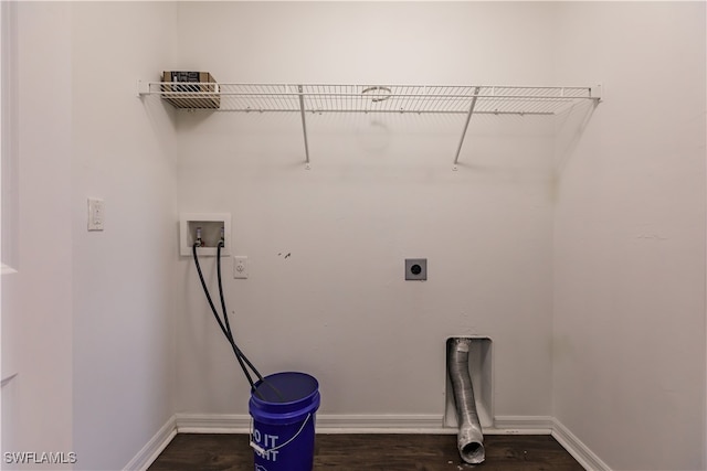 clothes washing area with hookup for a washing machine, electric dryer hookup, and dark hardwood / wood-style floors