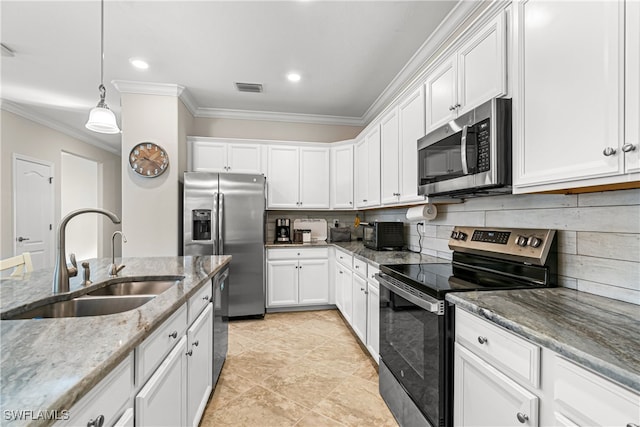 kitchen featuring white cabinetry, stainless steel appliances, sink, and decorative light fixtures