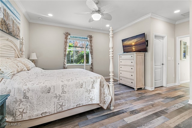 bedroom with ornamental molding, hardwood / wood-style flooring, and ceiling fan