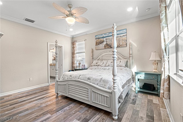 bedroom featuring ornamental molding, dark hardwood / wood-style floors, ensuite bathroom, and ceiling fan