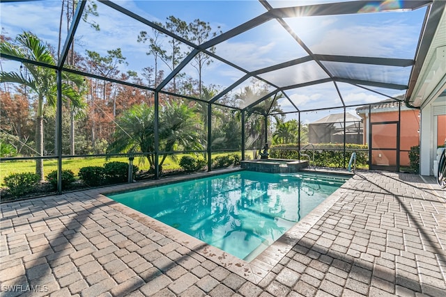 view of swimming pool featuring a patio area and a lanai