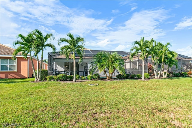 view of yard featuring glass enclosure