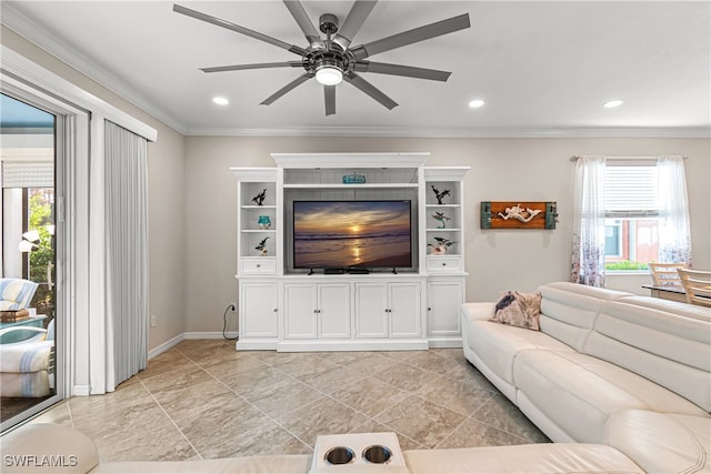 living room with crown molding, ceiling fan, and plenty of natural light