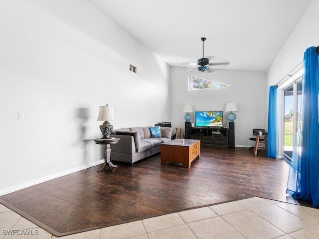 living room with lofted ceiling, hardwood / wood-style floors, and ceiling fan