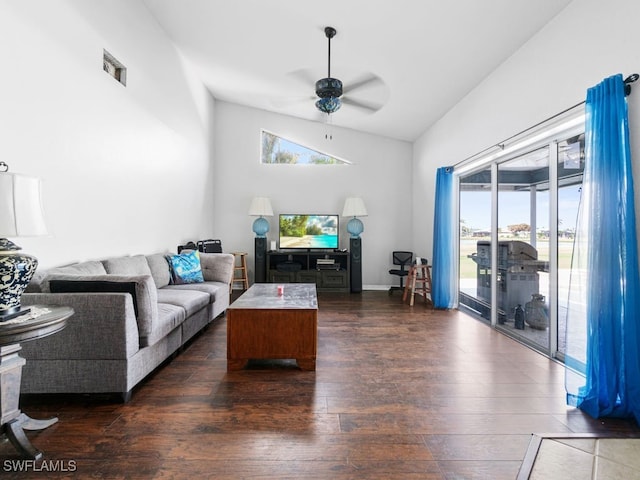 living room featuring lofted ceiling, ceiling fan, and dark hardwood / wood-style flooring