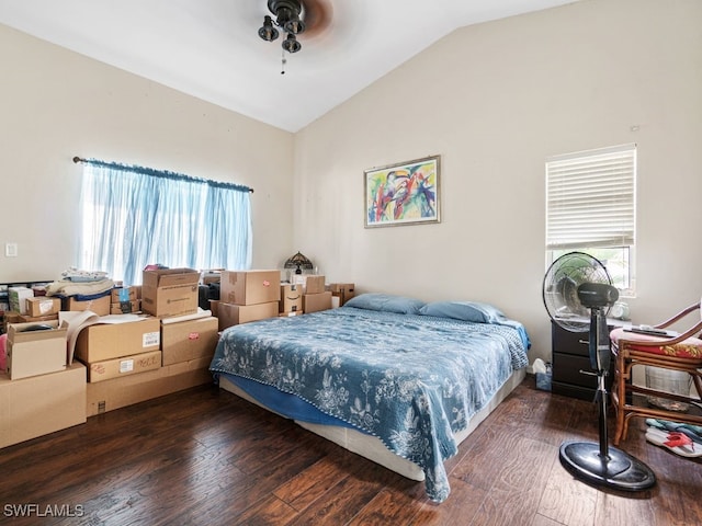 bedroom with vaulted ceiling and dark hardwood / wood-style flooring