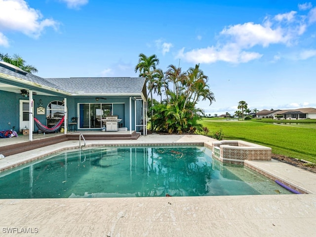 view of swimming pool featuring a yard, grilling area, an in ground hot tub, a patio area, and ceiling fan