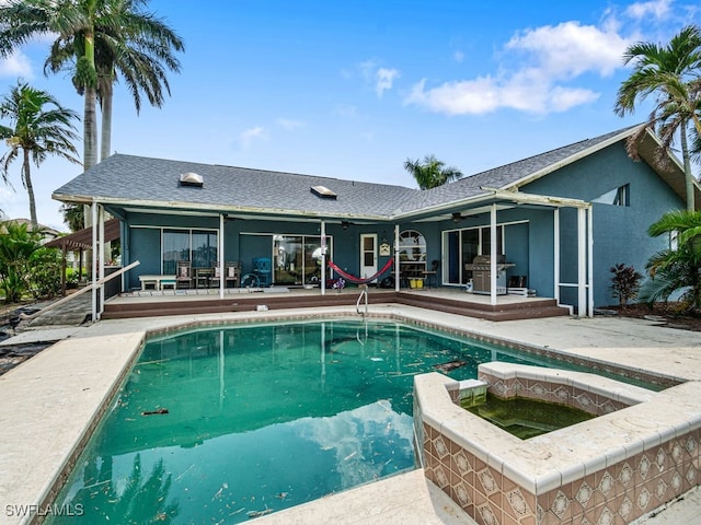 view of swimming pool featuring a patio area, a grill, and ceiling fan