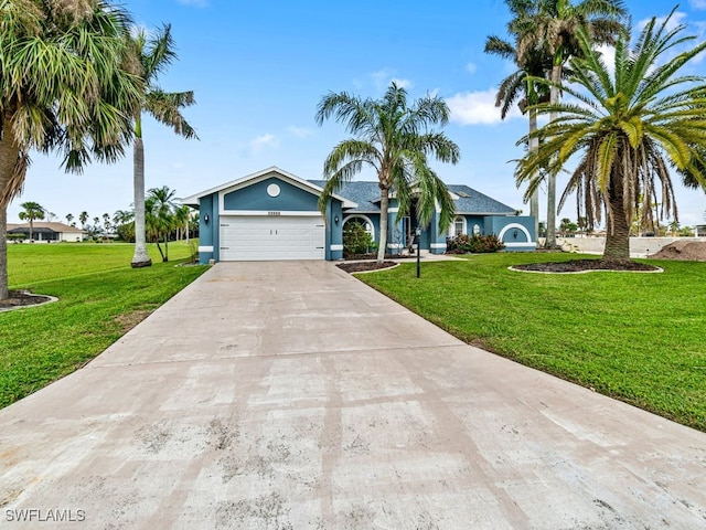 ranch-style house featuring a front yard and a garage