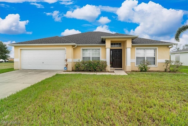 view of front facade featuring a front yard and a garage