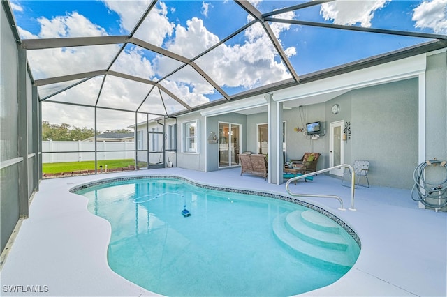 view of pool featuring a patio area and glass enclosure